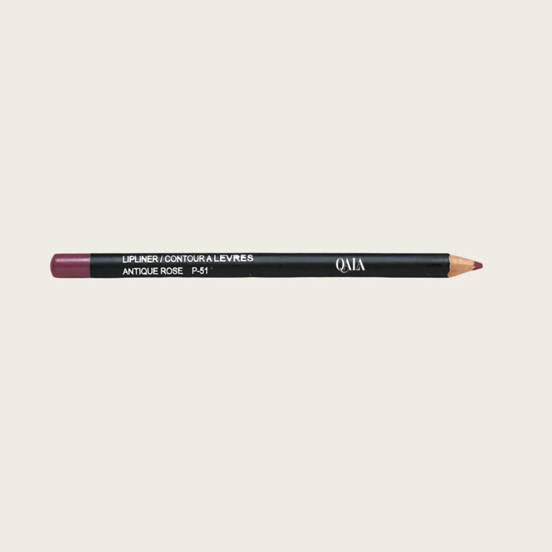A retractable lip liner pencil in antique rose color, with a smooth texture, displayed on a pink background. The product is labeled with 'QALA' and 'LIP LANE' and has the word 'AUTOMAGIC' printed on it.